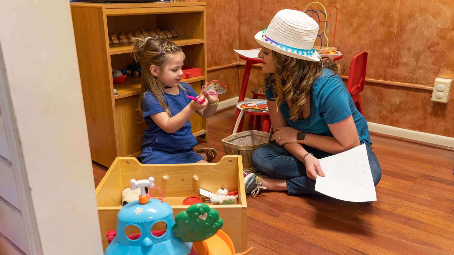 children's advocacy worker talking with girl